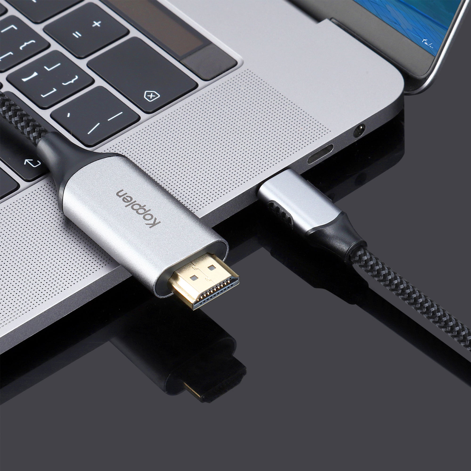 HDMI adapter cable USB-C plugged into MacBook
