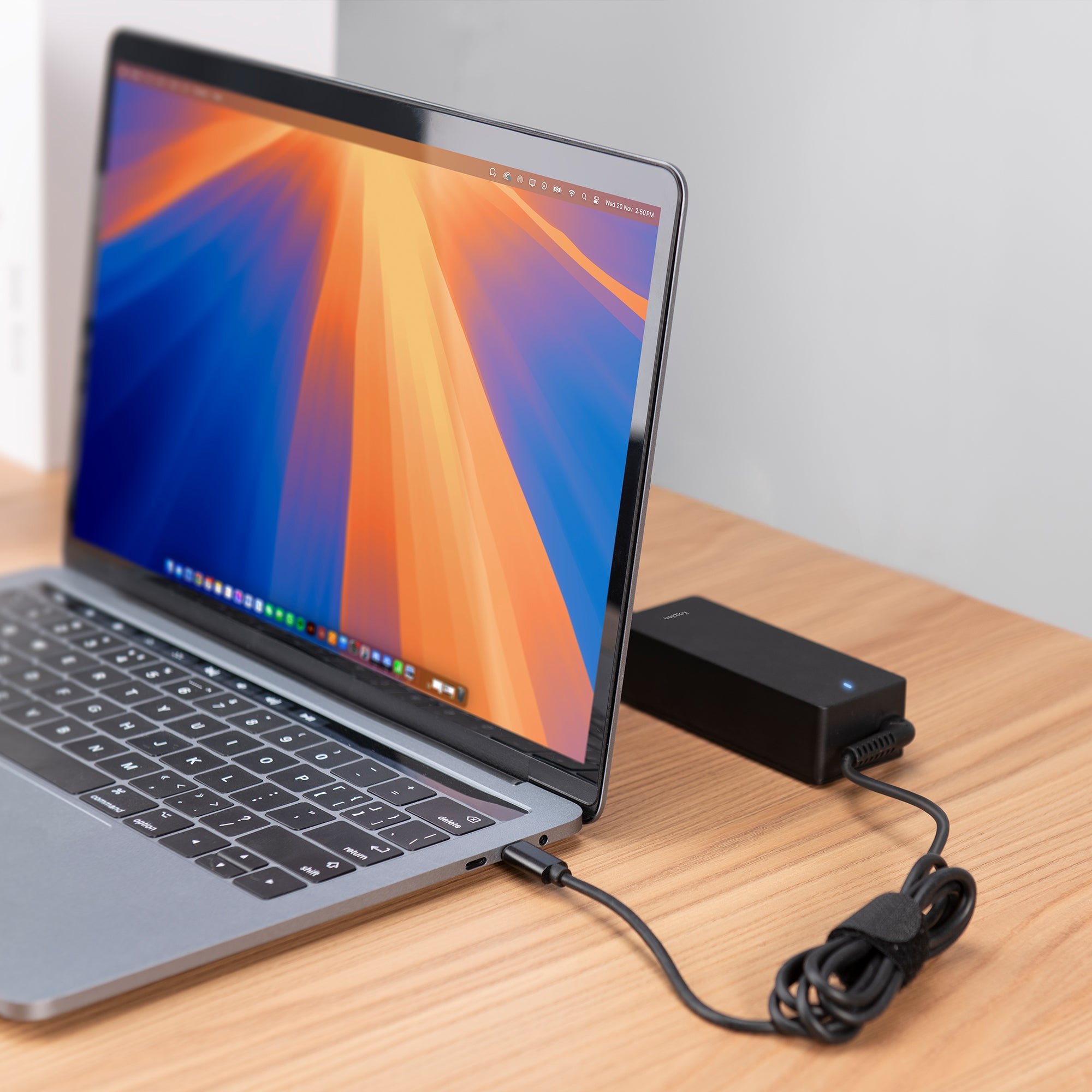Power adapter plugged into macbook via USB-C cable