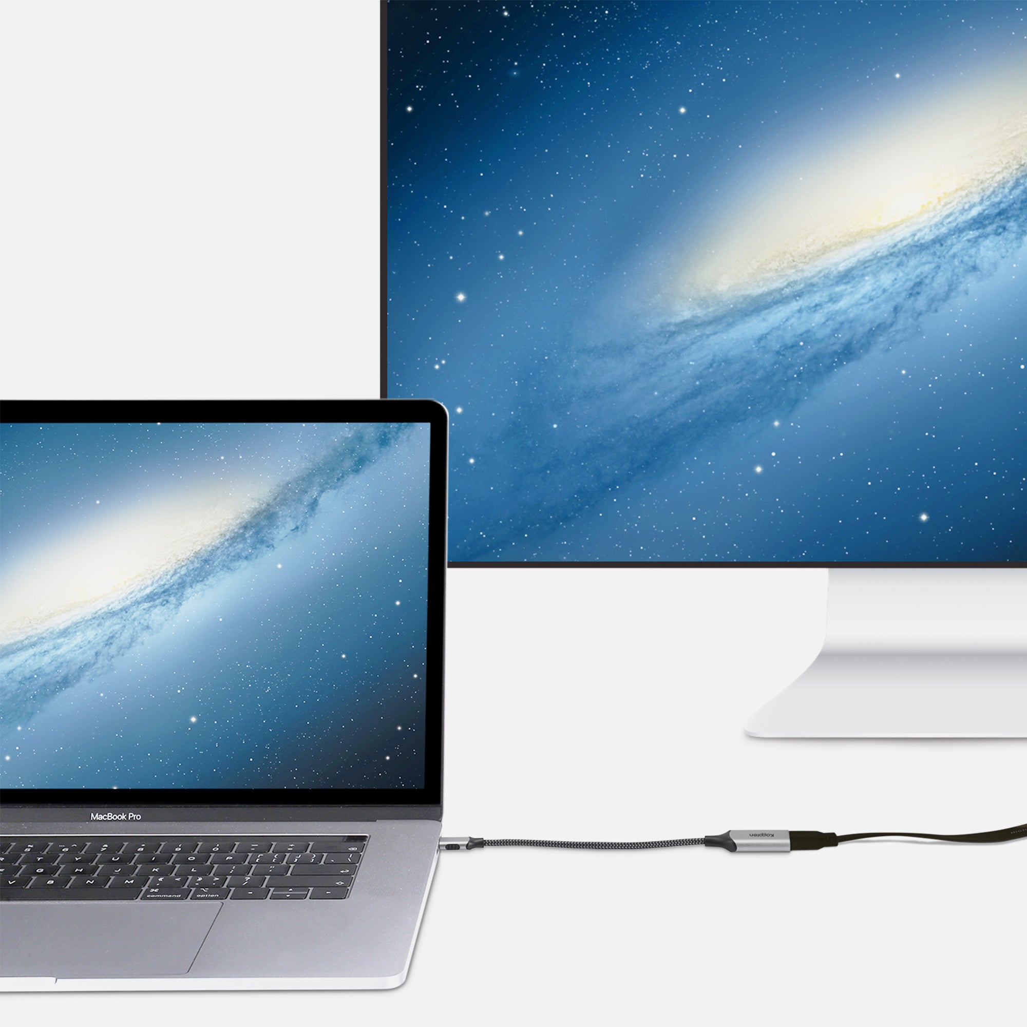 USB-C Cable plugged into MacBook and female HDMI connected to external monitor