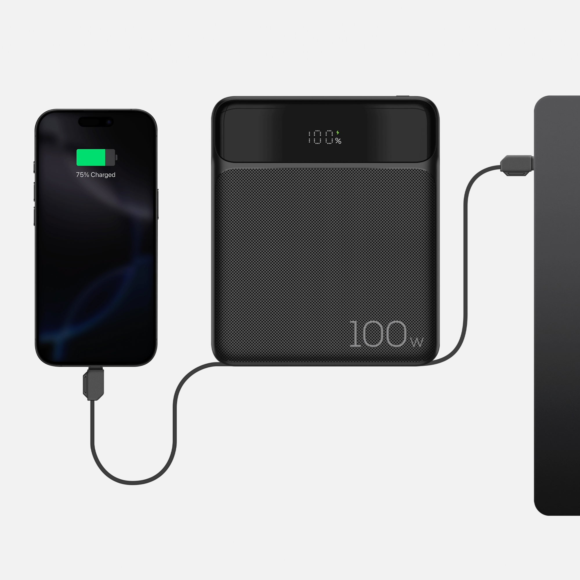 Slim power bank that is plugged into both an iPhone and a Macbook