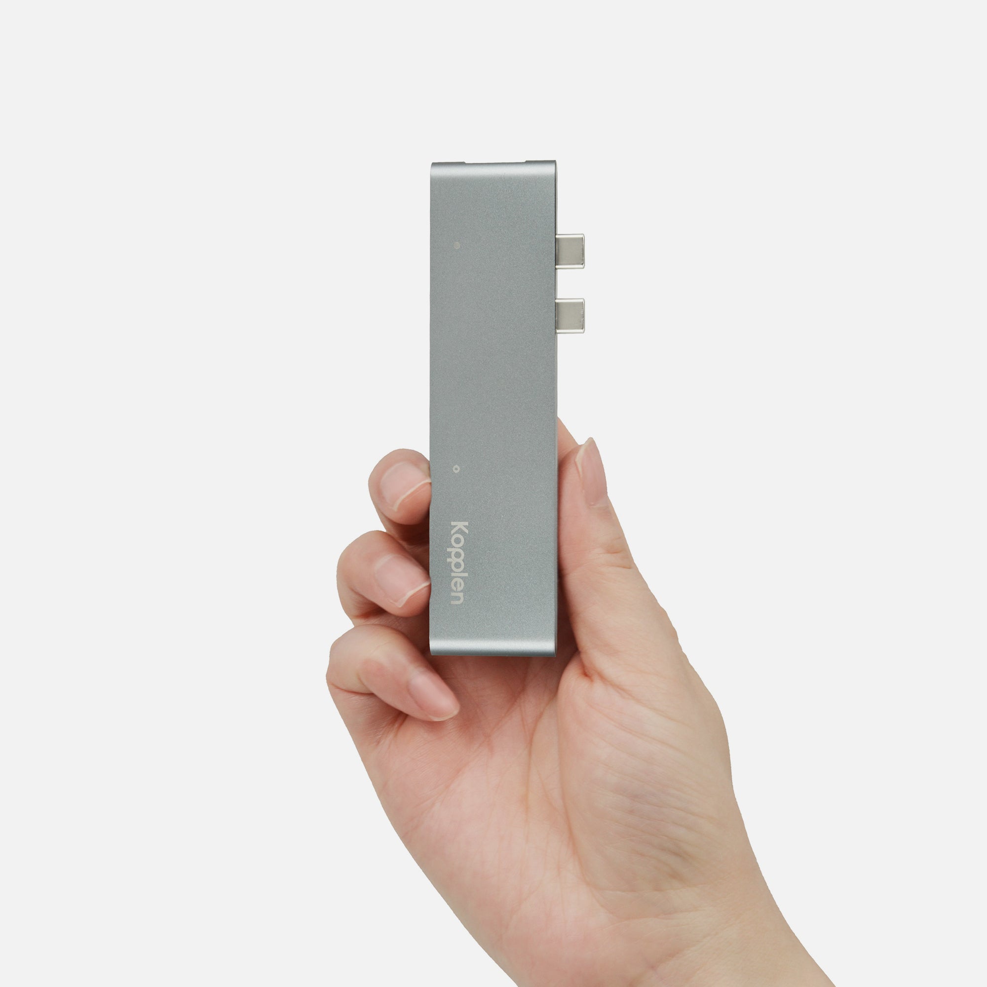 Hub held in-hand side-on to show USB-C connectors