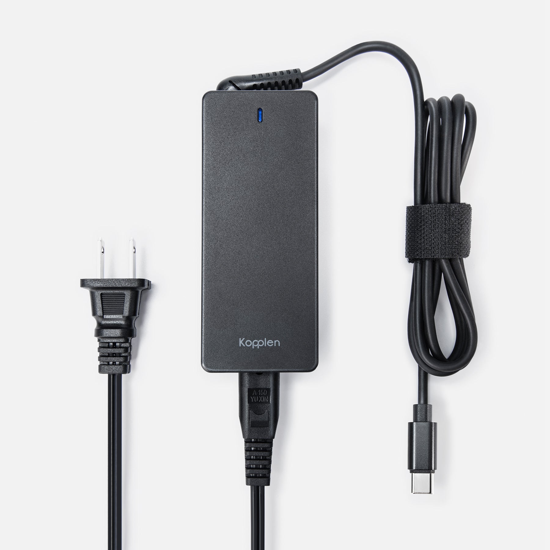 Power adapter with USB-C cable coiled up with loop keeping the cable it in place