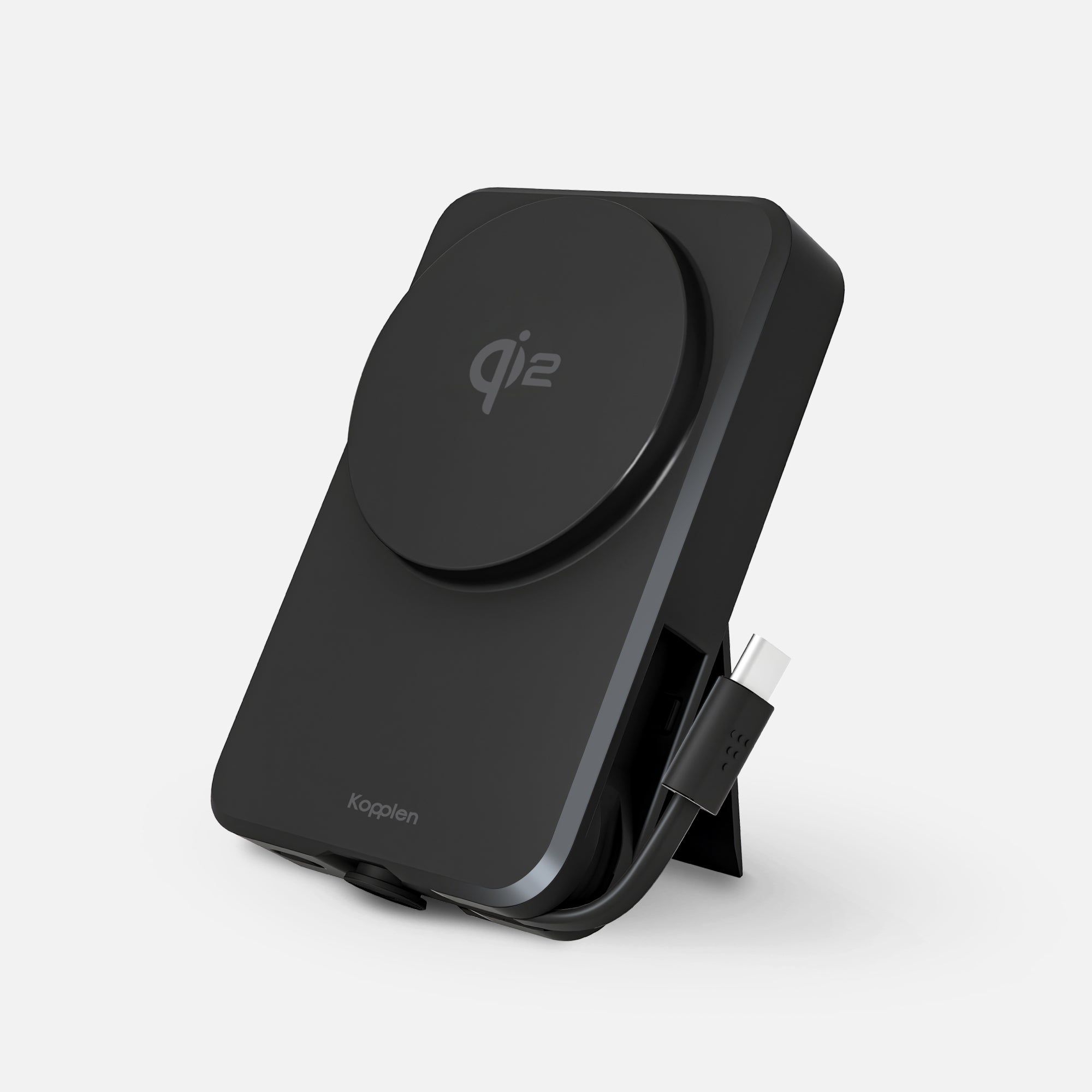 Power bank leaning on built-in stand with USB-C cable loose