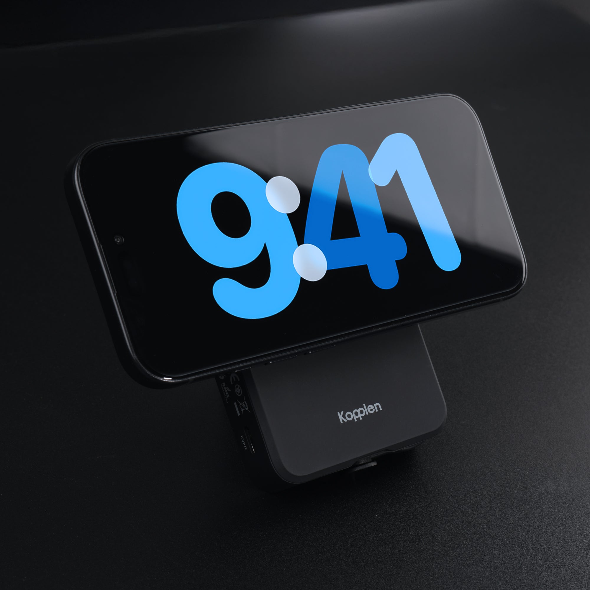 iPhone attached to power bank in landscape standby mode