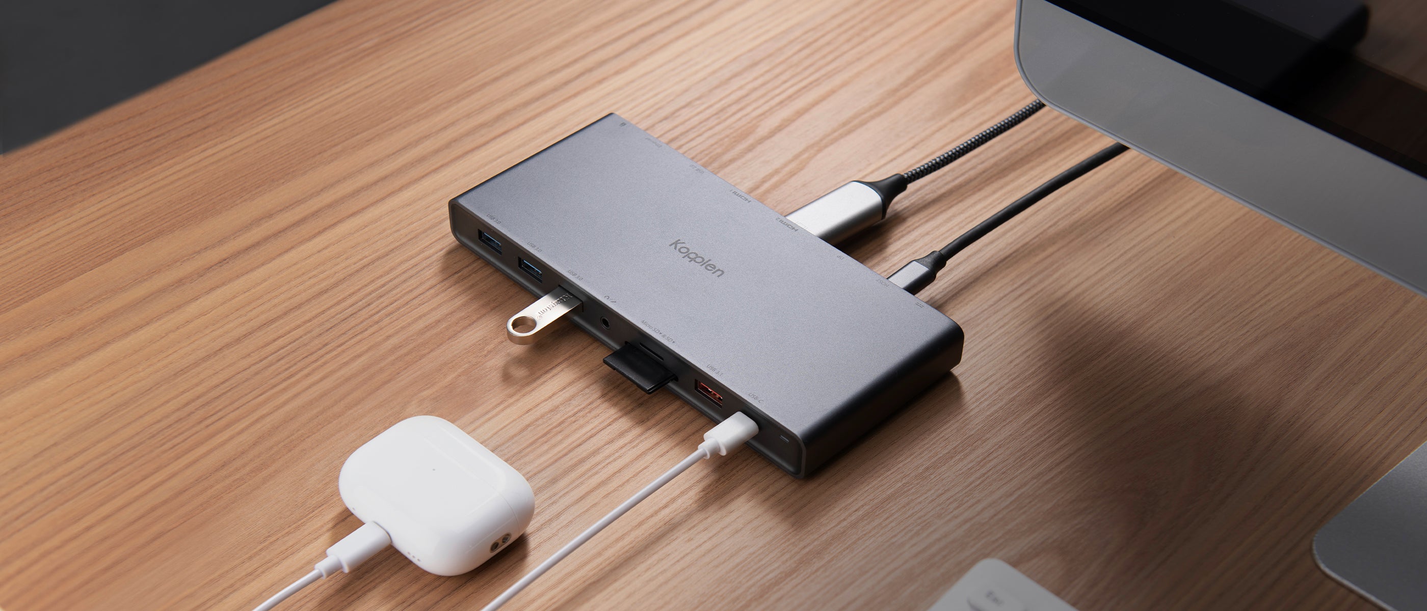 A 14 port hub on a desk with multiple cables plugged into it