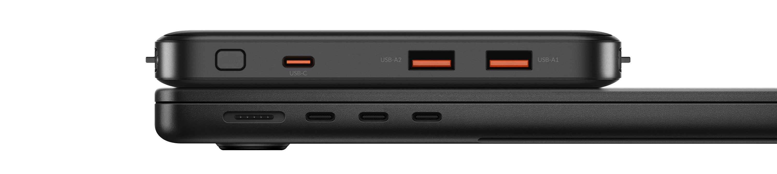 Close-up of a black power bank with multiple ports on a white background