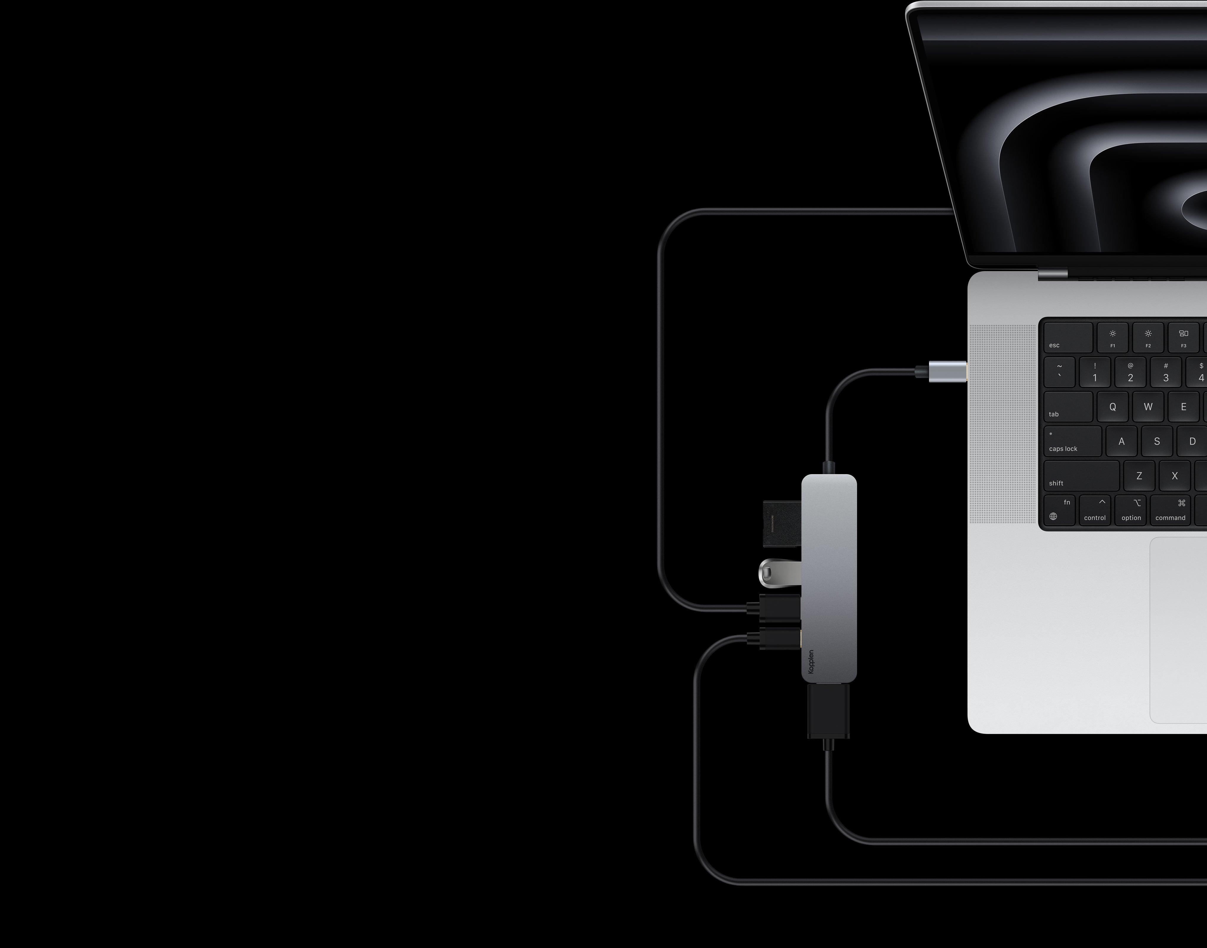 Usb-c hub plugged into MacBook, with various memory cards and sticks and cables plugged into the hub