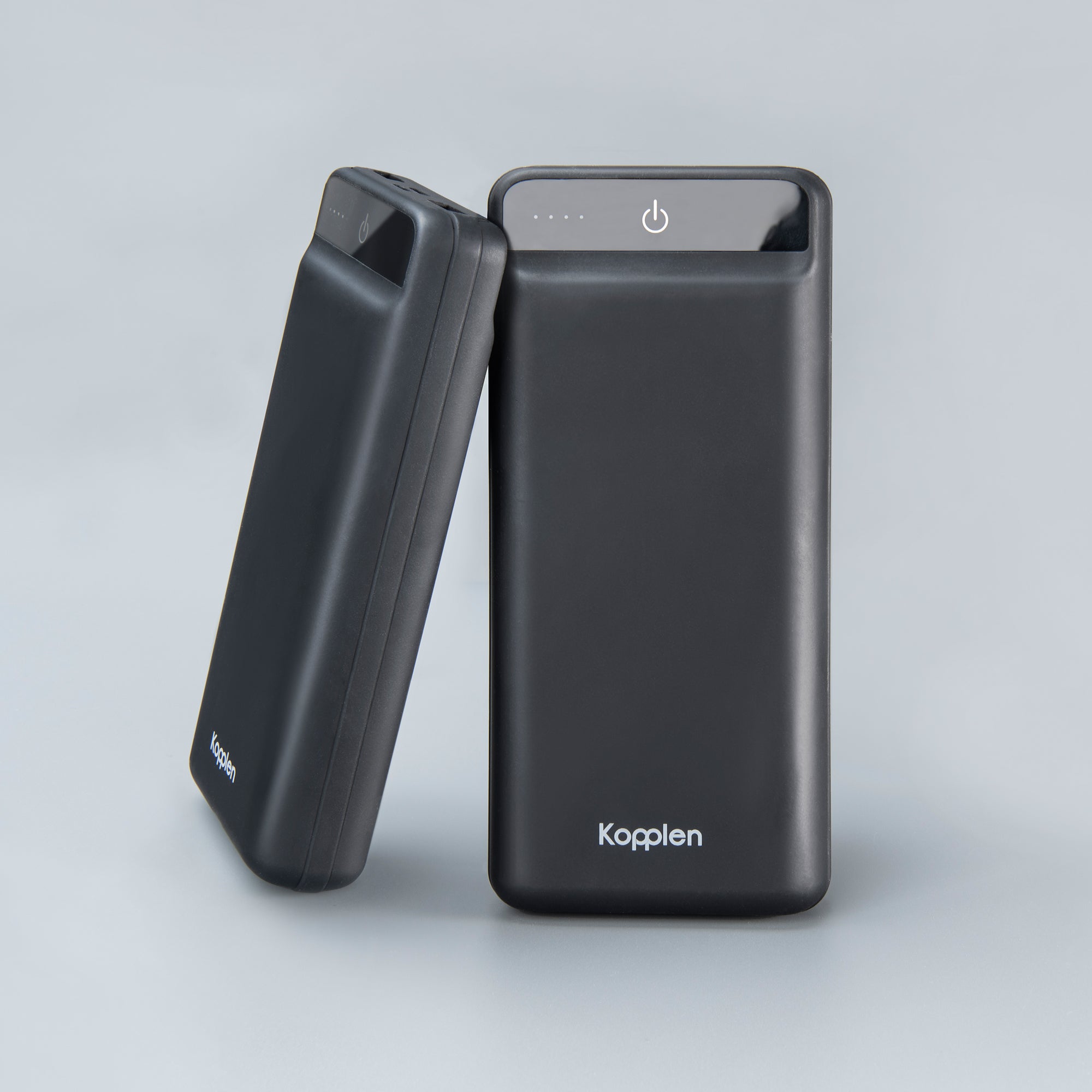 two power banks, one leaning on the other