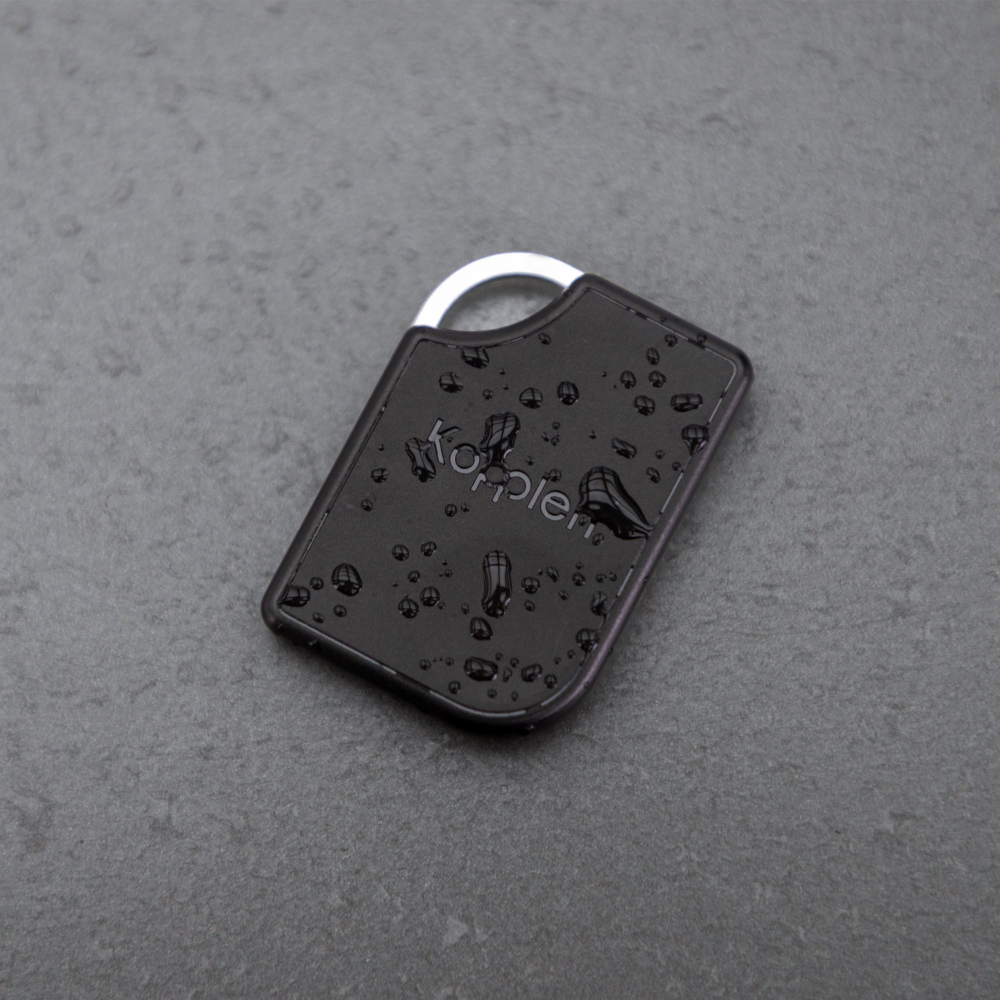 OmniTag on table covered in water droplets