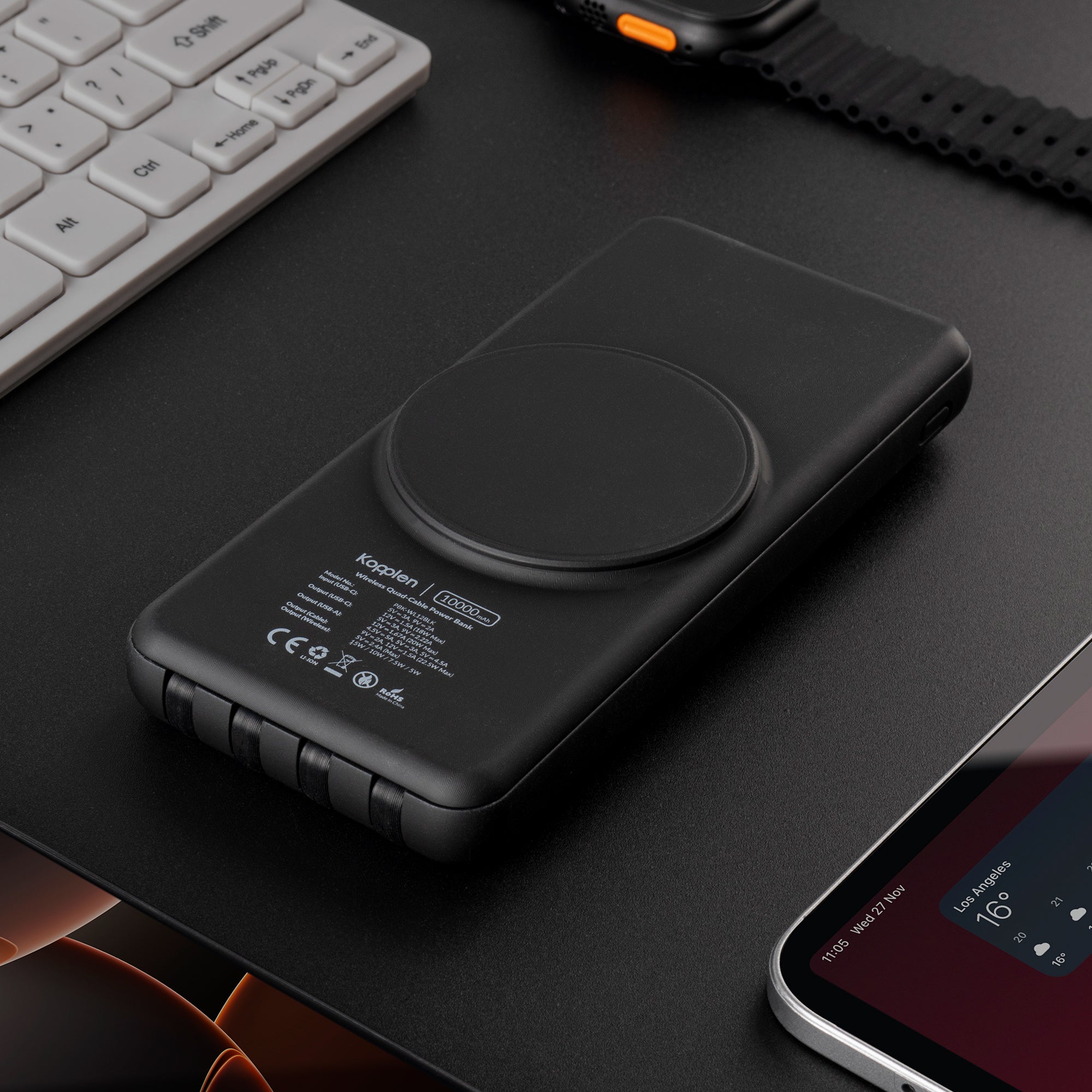 Power bank on desk with devices around